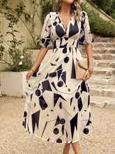 HIDDEN PASSAGE PRINTED MIDI DRESS - BEIGE